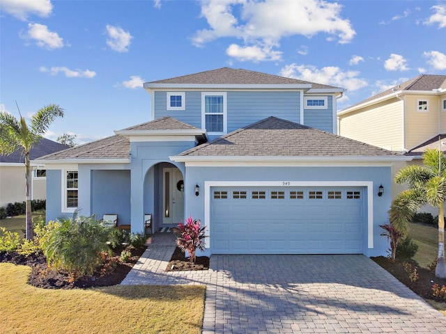 front of property with a garage