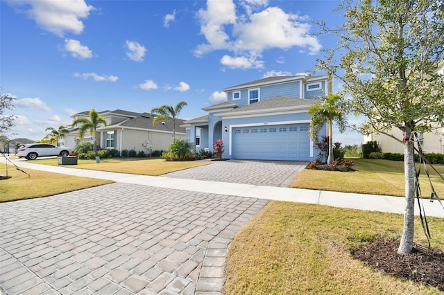 view of front property featuring a garage and a front lawn