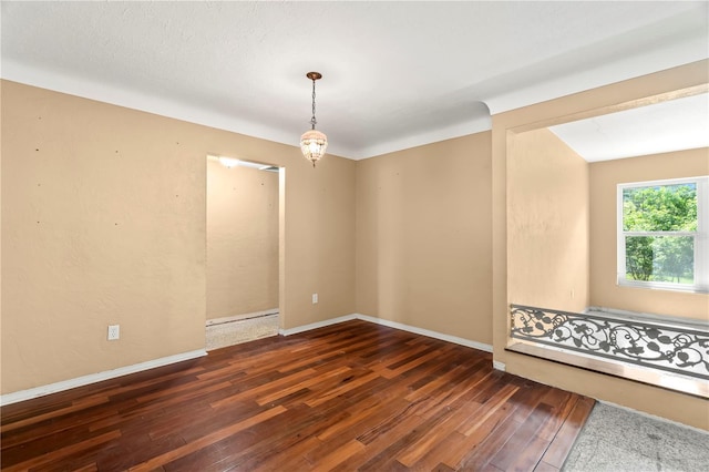 empty room with dark wood-type flooring