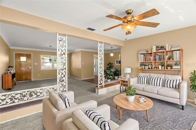 carpeted living room with ceiling fan