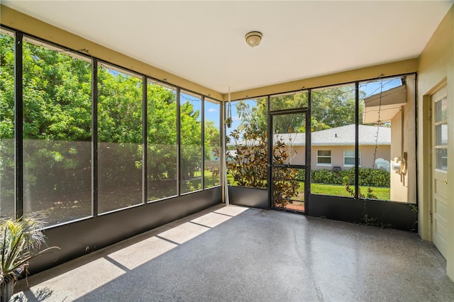 unfurnished sunroom with a wealth of natural light