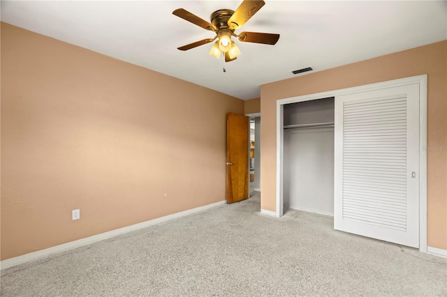 unfurnished bedroom featuring ceiling fan, a closet, and light carpet