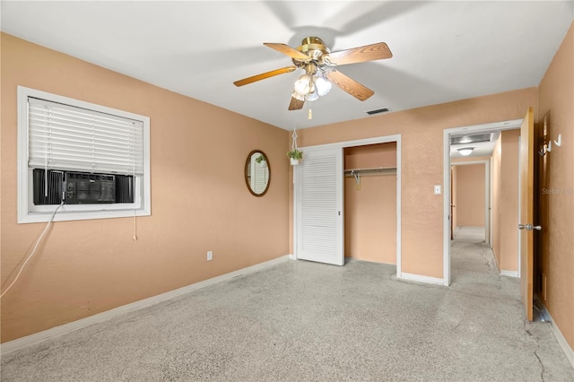 unfurnished bedroom featuring ceiling fan, a closet, and cooling unit