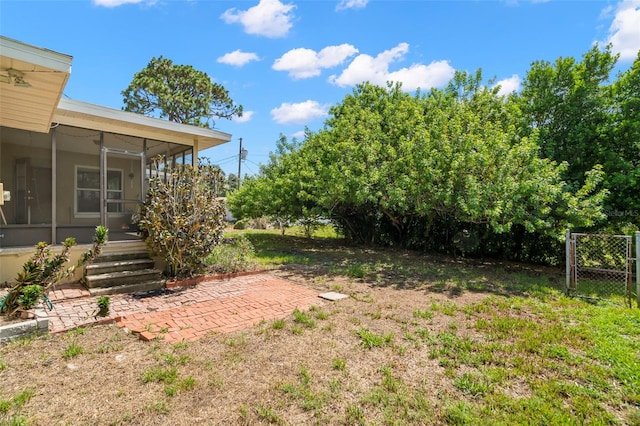 view of yard with a sunroom