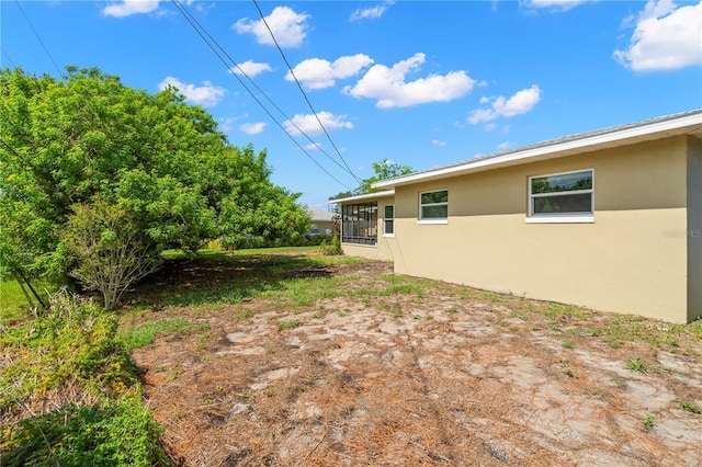 view of yard with a sunroom