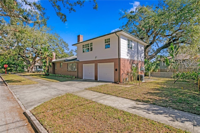 view of front property with a front yard and a garage