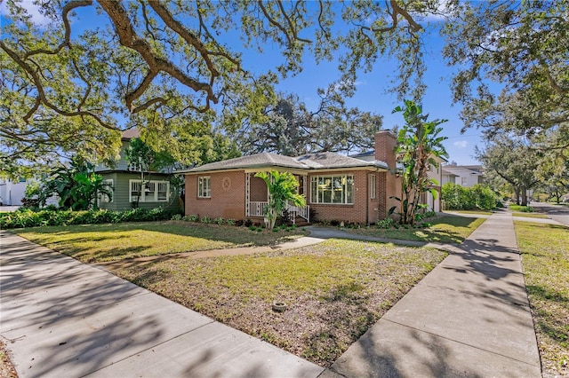 ranch-style house with a front lawn