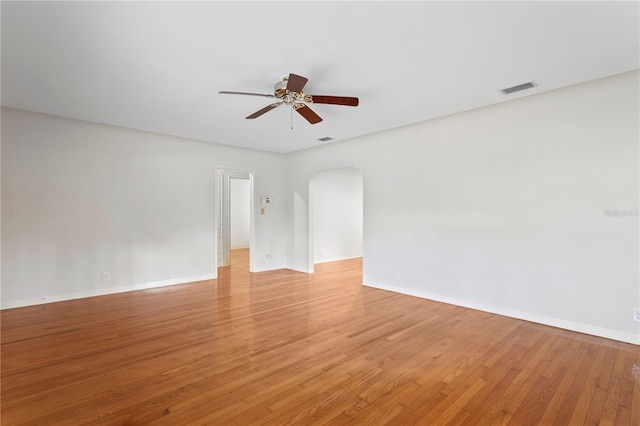 spare room featuring ceiling fan and light hardwood / wood-style floors