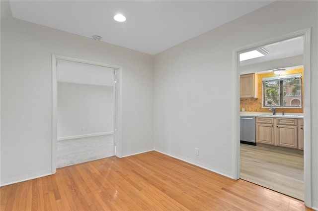 spare room featuring light wood-type flooring