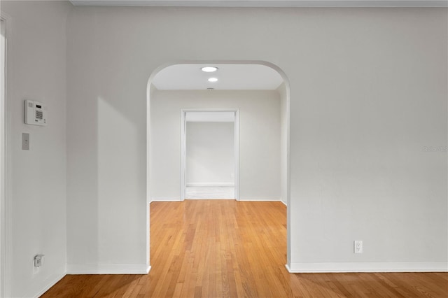 corridor with light wood-type flooring