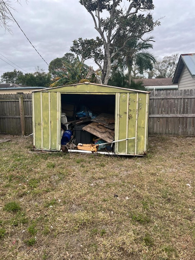 view of outbuilding featuring a lawn