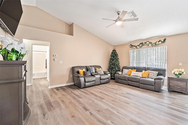 living room featuring light wood-type flooring, ceiling fan, and lofted ceiling