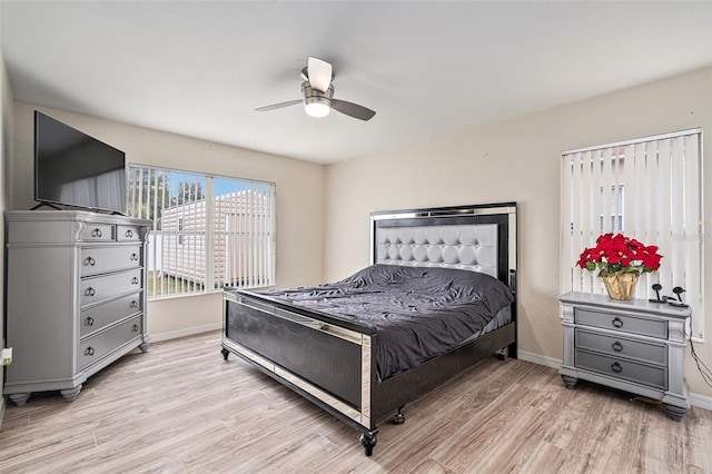 bedroom featuring ceiling fan and light hardwood / wood-style floors