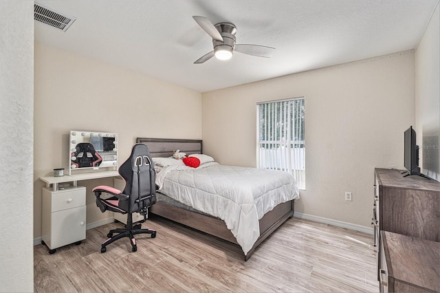 bedroom with light hardwood / wood-style floors and ceiling fan