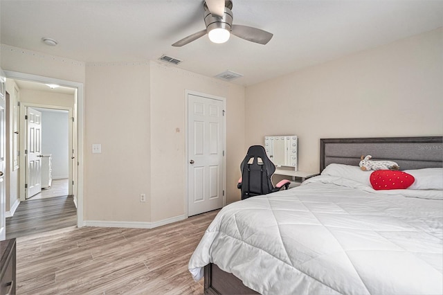 bedroom with ceiling fan and light hardwood / wood-style flooring