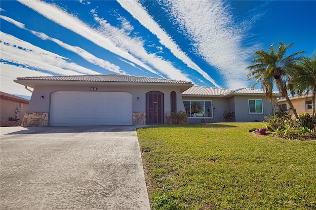 view of front of home with a garage and a front yard