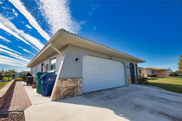 view of side of home featuring a garage