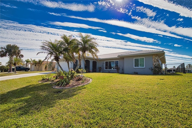 view of front facade featuring a garage and a front lawn