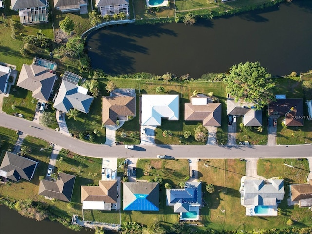 drone / aerial view with a water view