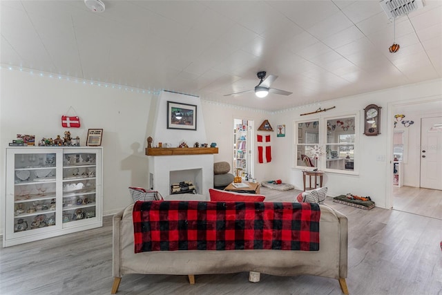 living room with ceiling fan and wood-type flooring