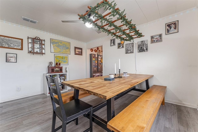 dining room with hardwood / wood-style floors