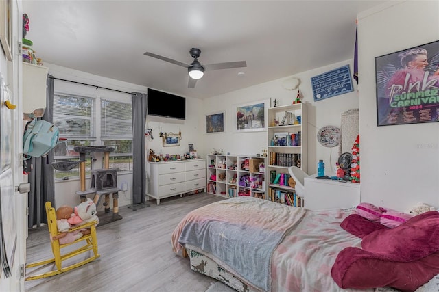 bedroom with ceiling fan and hardwood / wood-style floors