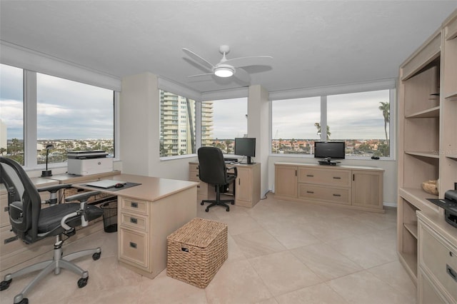 tiled office featuring ceiling fan