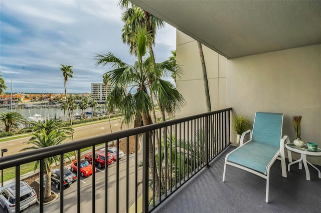 balcony featuring a water view