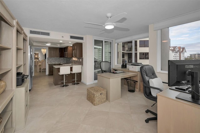 office area featuring ceiling fan and sink