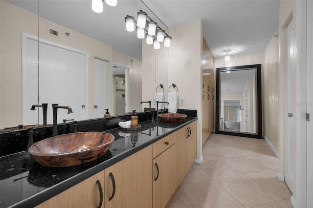 bathroom featuring vanity and tile patterned flooring