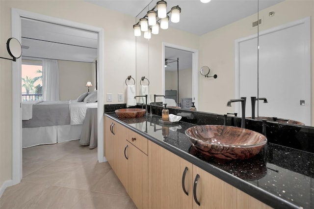 bathroom with tile patterned floors and vanity