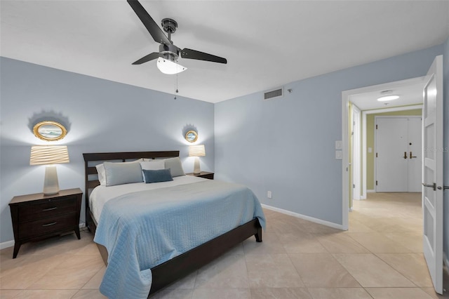 tiled bedroom with ceiling fan