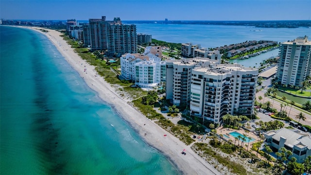 birds eye view of property featuring a water view and a view of the beach