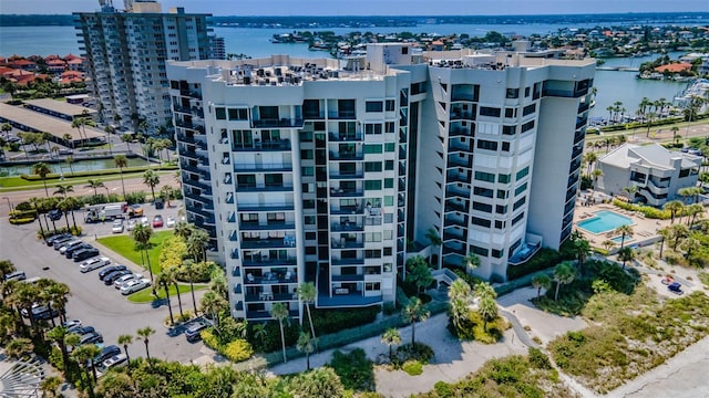 birds eye view of property with a water view