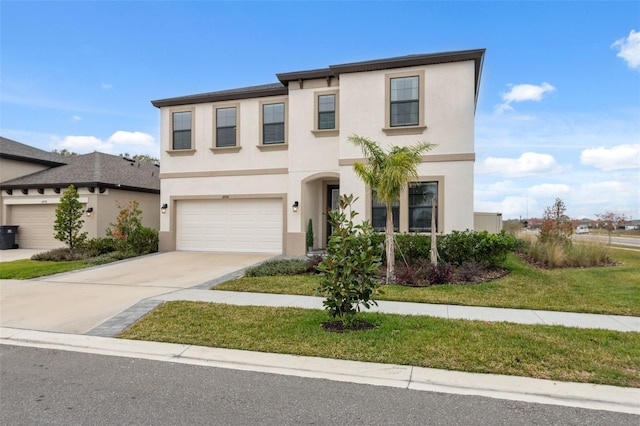 view of front of house with a garage and a front lawn