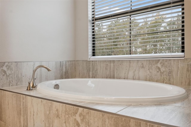 bathroom featuring a relaxing tiled tub