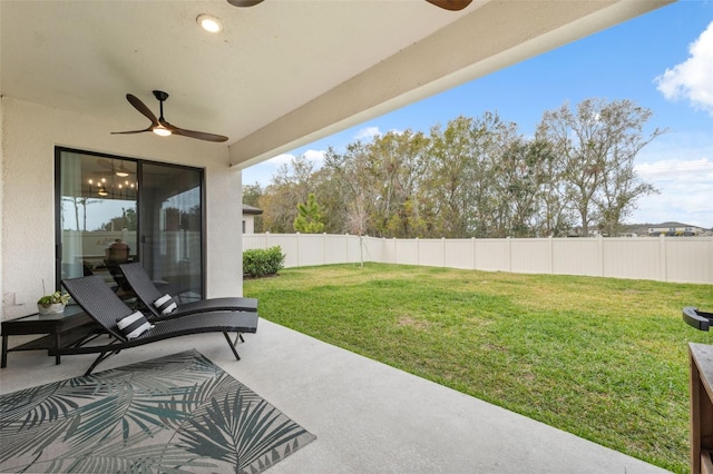 view of yard featuring ceiling fan and a patio area