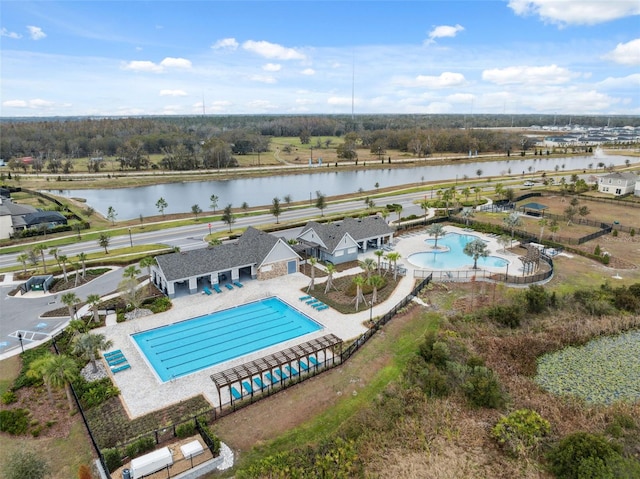 view of swimming pool featuring a water view