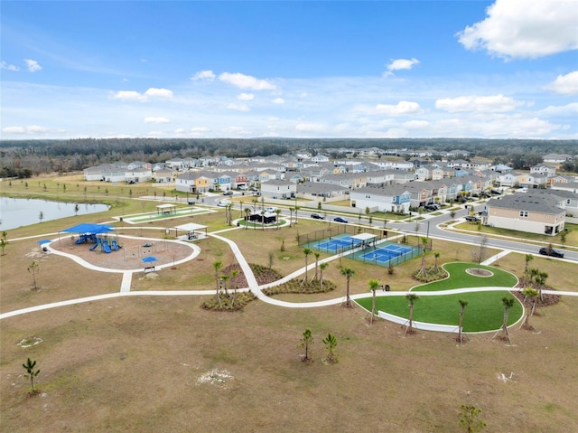 birds eye view of property with a water view