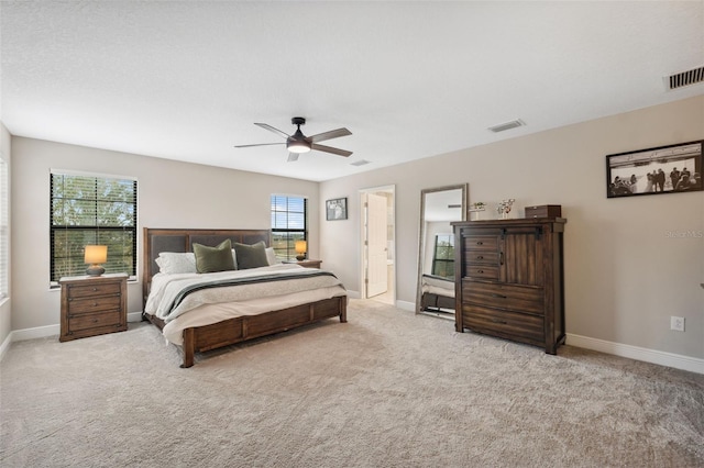 14786 Horse Trot Rd, Lithia, FL 33547 - carpeted bedroom featuring baseboards, a ceiling fan, and ensuite bath