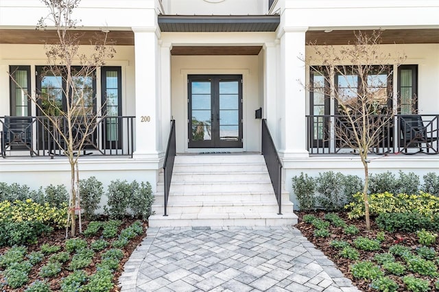 view of exterior entry featuring french doors