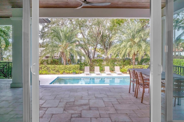 view of pool with ceiling fan and a patio