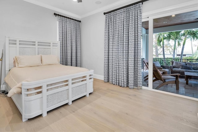 bedroom featuring light wood-type flooring, ceiling fan, and ornamental molding