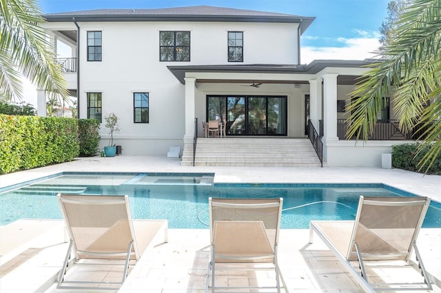 back of house with ceiling fan, a fenced in pool, and a patio