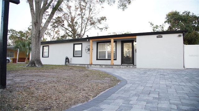 ranch-style home with a porch