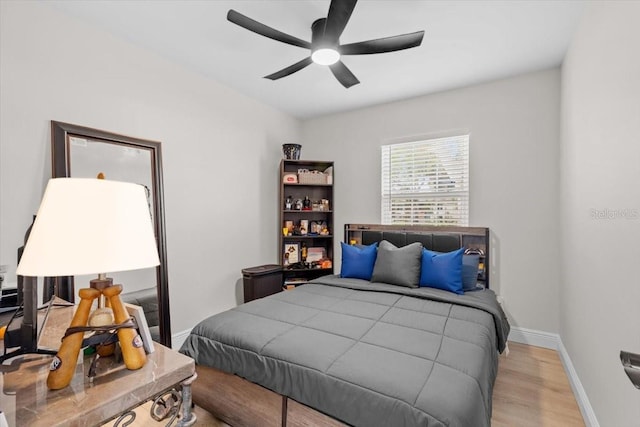 bedroom featuring ceiling fan and light hardwood / wood-style floors