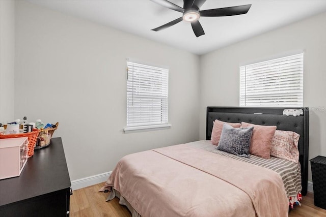 bedroom featuring ceiling fan and light hardwood / wood-style flooring