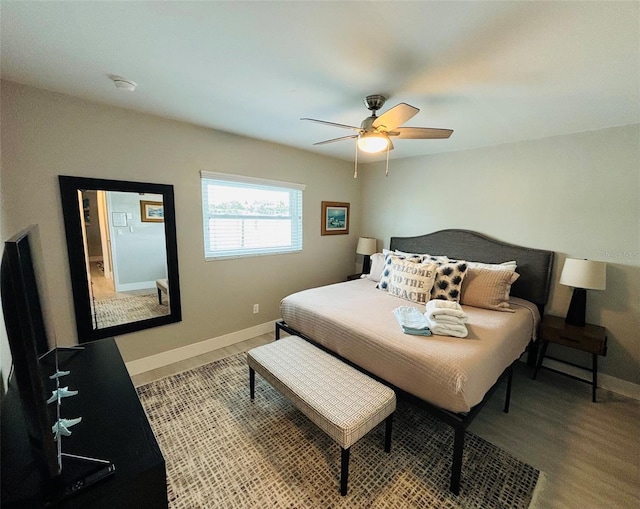 bedroom with ceiling fan and hardwood / wood-style flooring