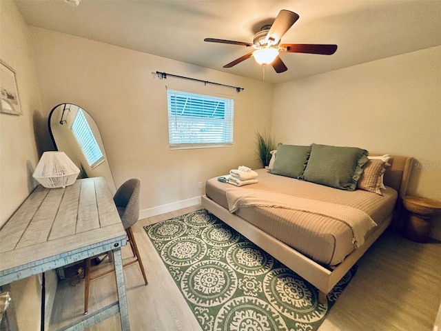 bedroom featuring ceiling fan and wood-type flooring