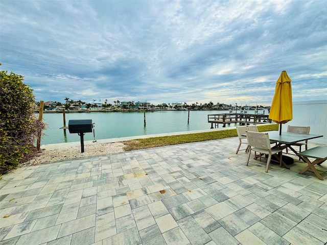 view of patio featuring a water view